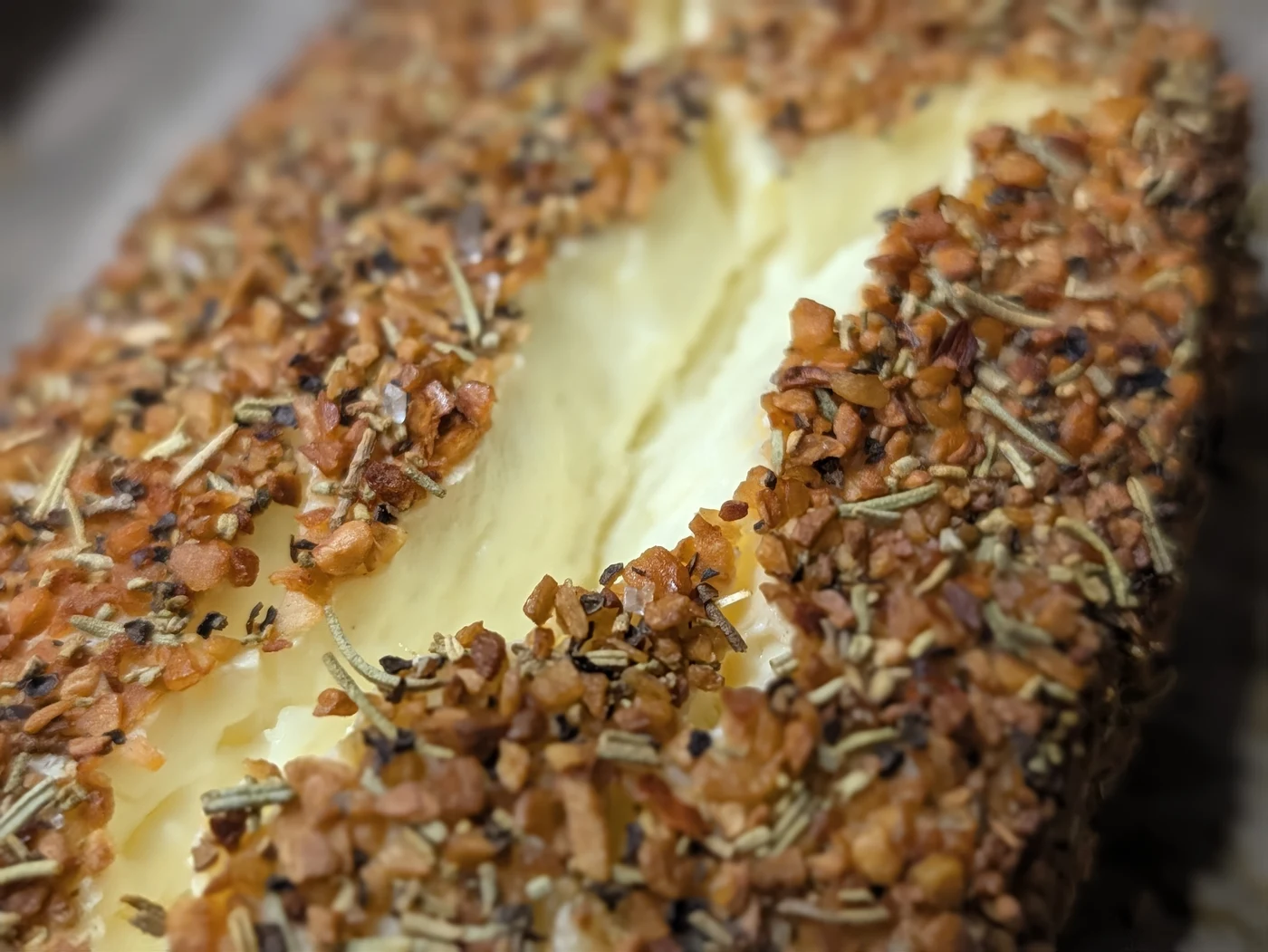 Close-up of diamond crosshatch crust with toasted Everything Bagel seeds and garlic